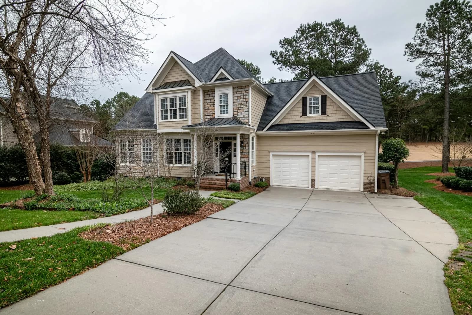 Suburban home exterior with clean driveway and warm residential curb appeal.